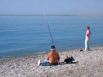 Рыбак на пляже Ниццы